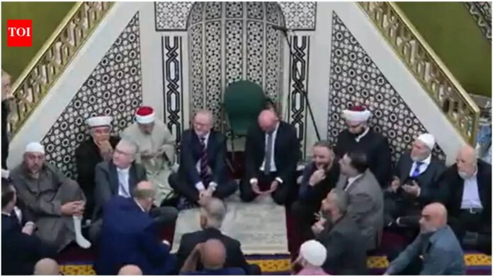'Get 'em out of here': Australian PMs Anthony Albanese and Tony Burke question support for Israel at Eid prayers in Sydney - watch

