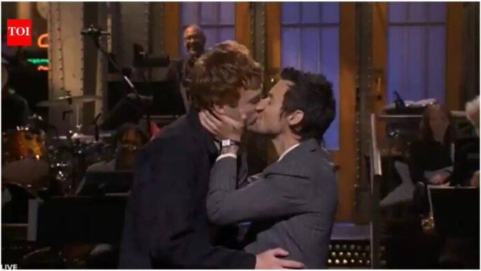 'Now that's queerbait': Harry Styles accidentally kisses male comedian to complete 'Saturday Night Live' monologue


