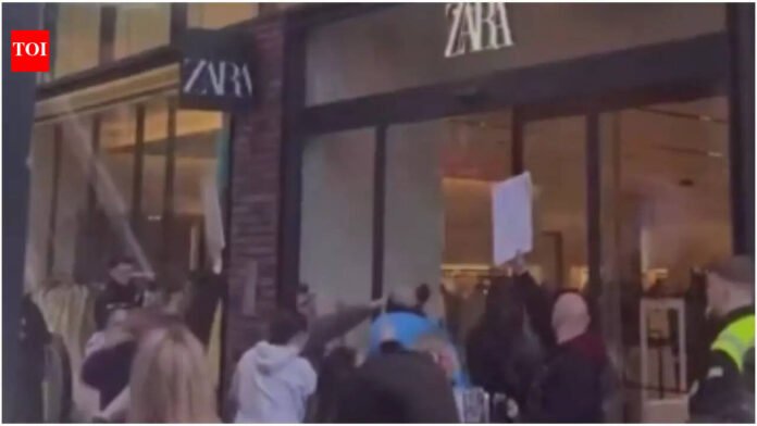 'Shame on you': Zara protests outside Bristol UK after girl attacked by group

