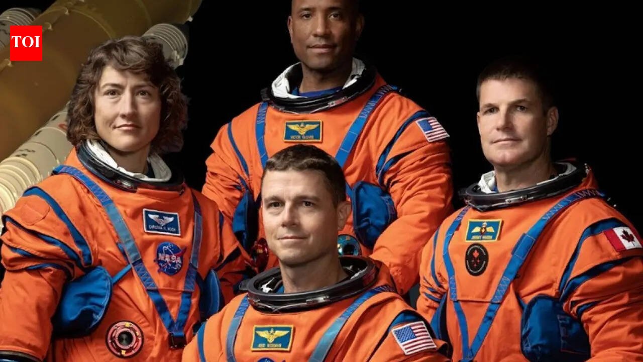 Why did NASA's Artemis 2 astronauts wear bright orange spacesuits on this historic mission?