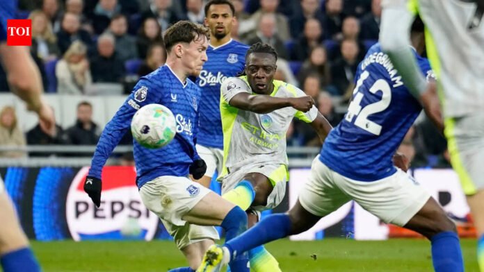 Premier League: Doku's late goal saves Manchester City but Arsenal take control of title race

