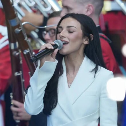 Kash Patel's girlfriend says it's an honor to sing national anthem on Freedom250, she doesn't charge money