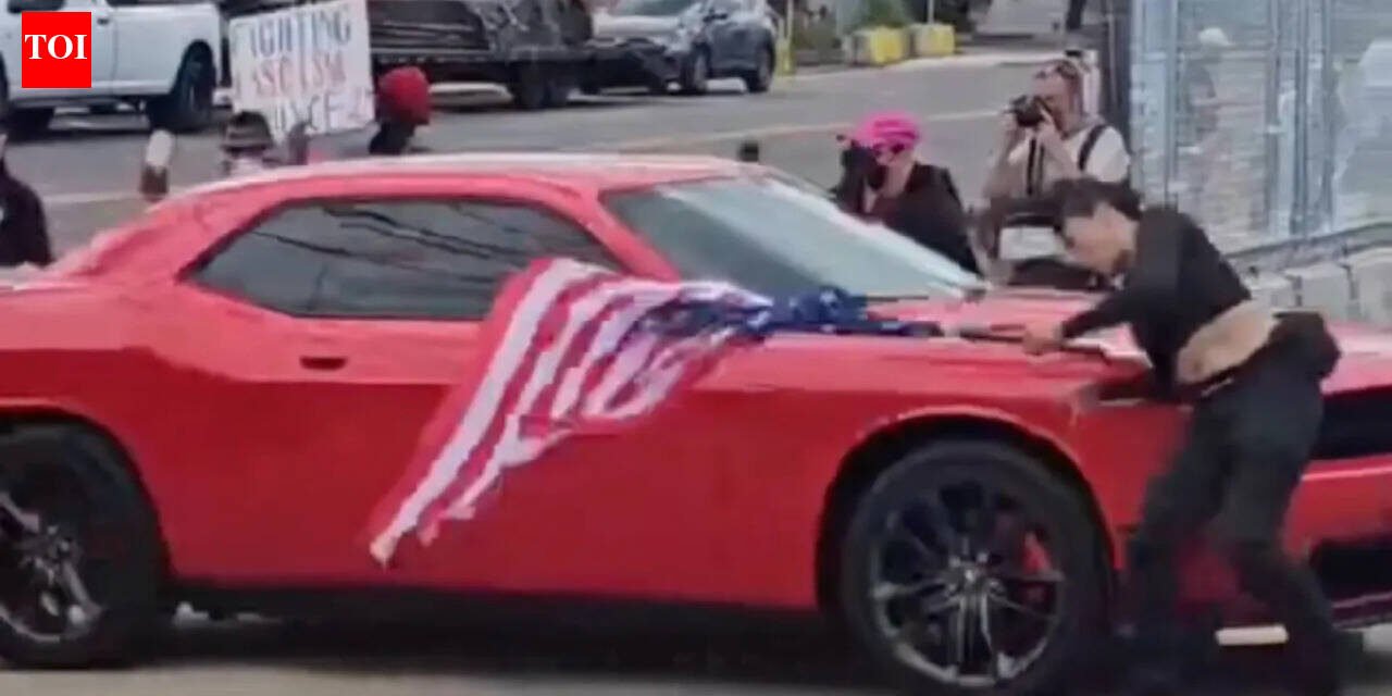 New Jersey anti-ICE protester waving an upside-down American flag was hit by a car and video shows she was thrown to the ground