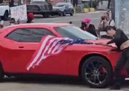 New Jersey anti-ICE protester waving an upside-down American flag was hit by a car and video shows she was thrown to the ground