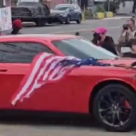 New Jersey anti-ICE protester waving an upside-down American flag was hit by a car and video shows she was thrown to the ground