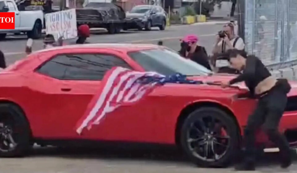 New Jersey anti-ICE protester waving an upside-down American flag was hit by a car and video shows she was thrown to the ground