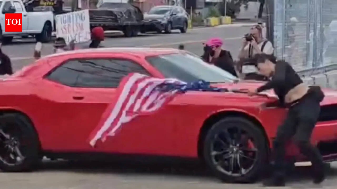 New Jersey anti-ICE protester waving an upside-down American flag was hit by a car and video shows she was thrown to the ground