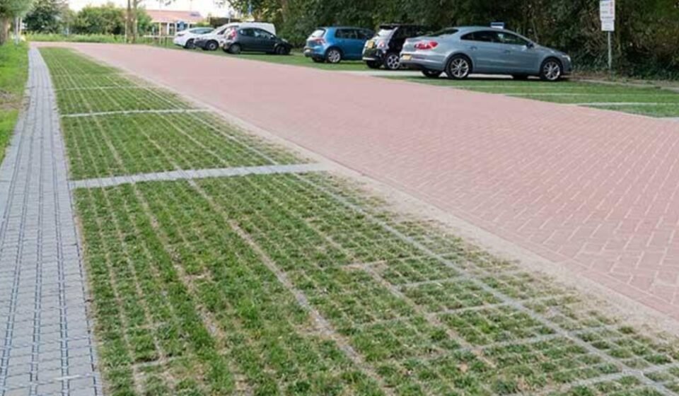 Dutch cities are replacing solid concrete surfaces with grass-covered pavers that absorb rainwater and help keep urban areas cool