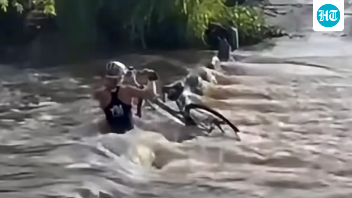 Female cyclist sucked underwater while trying to cross bridge; survives (KOLD NEWS)