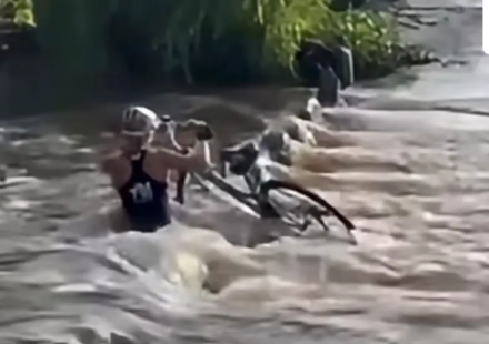 Female cyclist sucked underwater while trying to cross bridge; survives (KOLD NEWS)