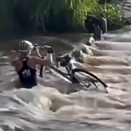 Female cyclist sucked underwater while trying to cross bridge; survives (KOLD NEWS)