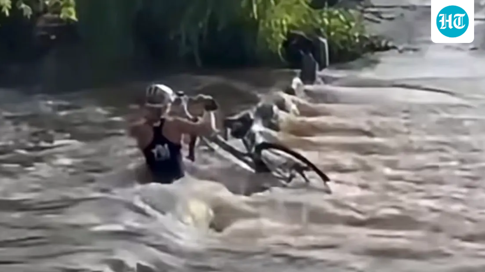 Female cyclist sucked underwater while trying to cross bridge; survives (KOLD NEWS)