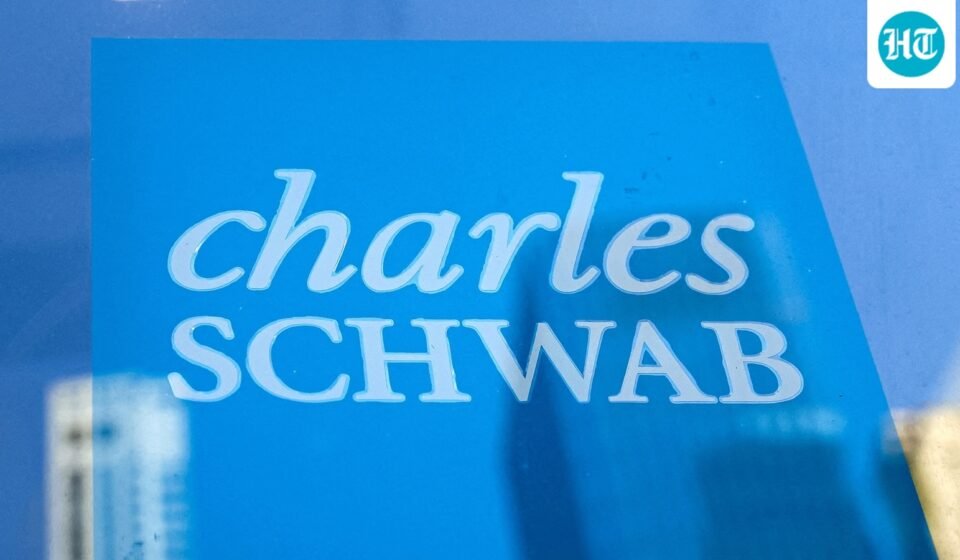 The company logo of Charles Schwab is displayed at a location in the financial district in New York. (REUTERS)