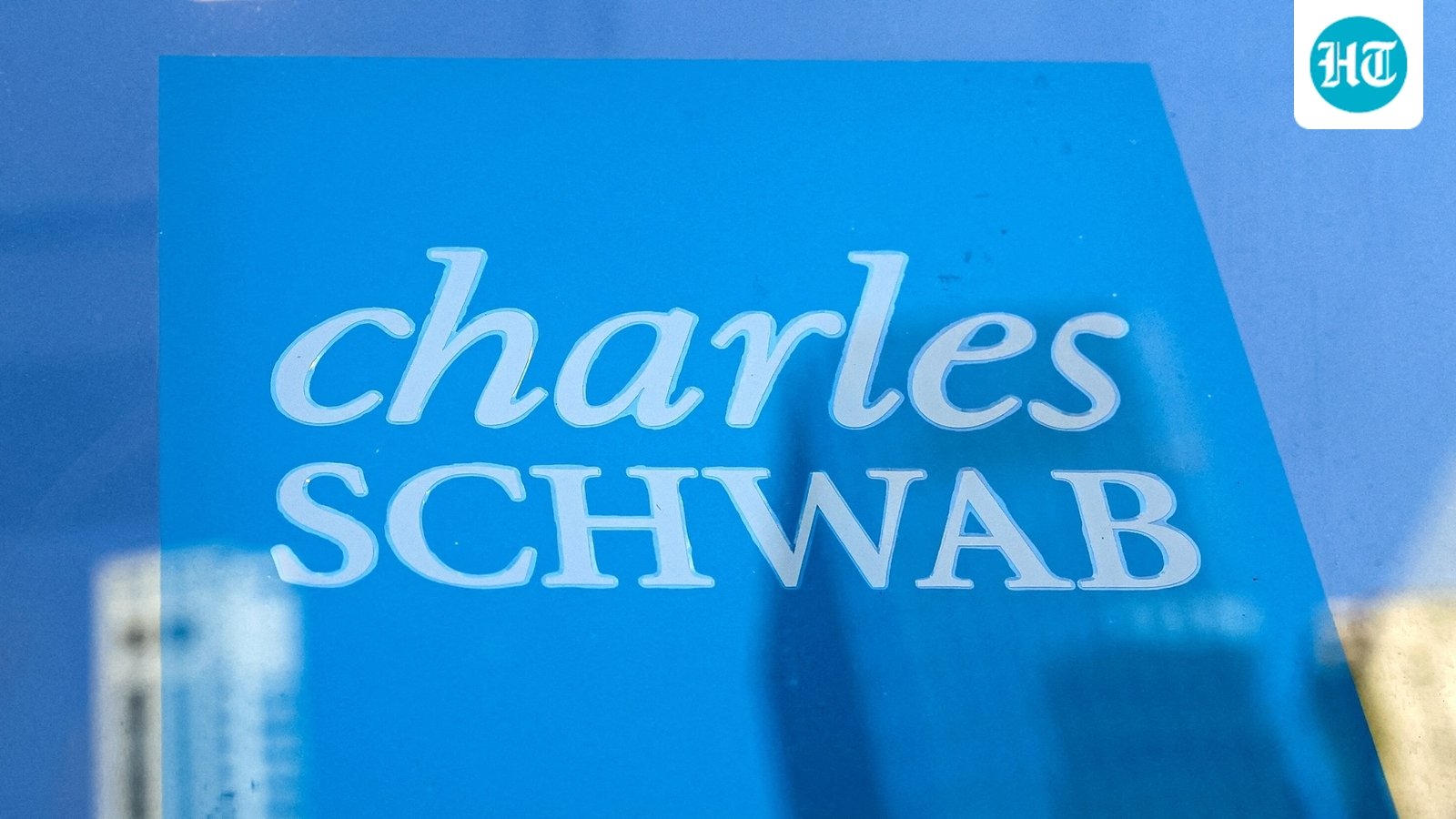 The company logo of Charles Schwab is displayed at a location in the financial district in New York. (REUTERS)