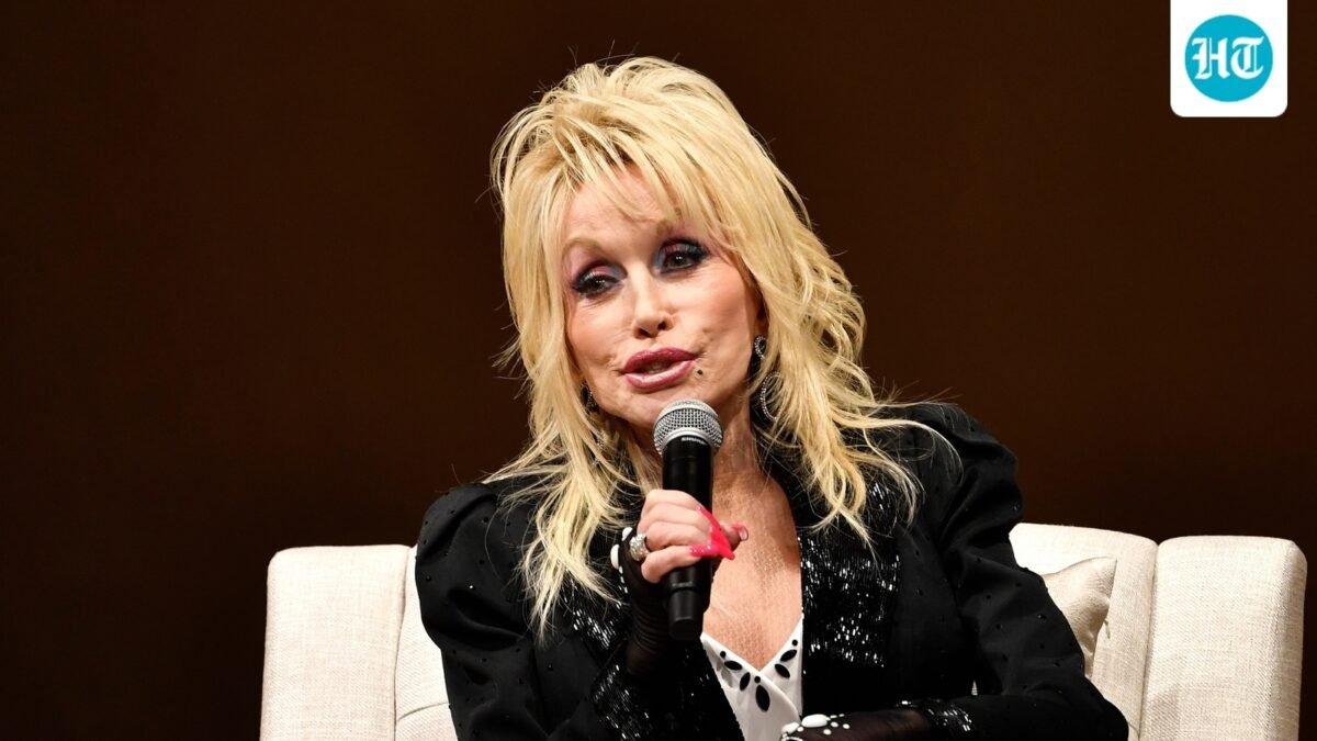 Dolly Parton speaks to a audience gathered to celebrate the expansion of the Imagination Library of Kentucky at the Lyric Theatre in Lexington, Ky. (AP Photo/Timothy D. Easley)
