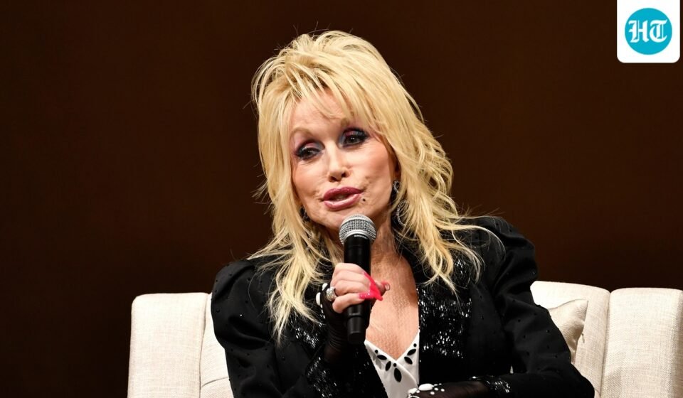 Dolly Parton speaks to a audience gathered to celebrate the expansion of the Imagination Library of Kentucky at the Lyric Theatre in Lexington, Ky. (AP Photo/Timothy D. Easley)