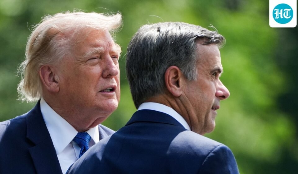 Donald Trump and John Ratcliffe, Director of the Central Intelligence Agency (CIA), speak as they depart after a Cabinet meeting at Camp David in Thurmont, Maryland on July 31. (REUTERS)