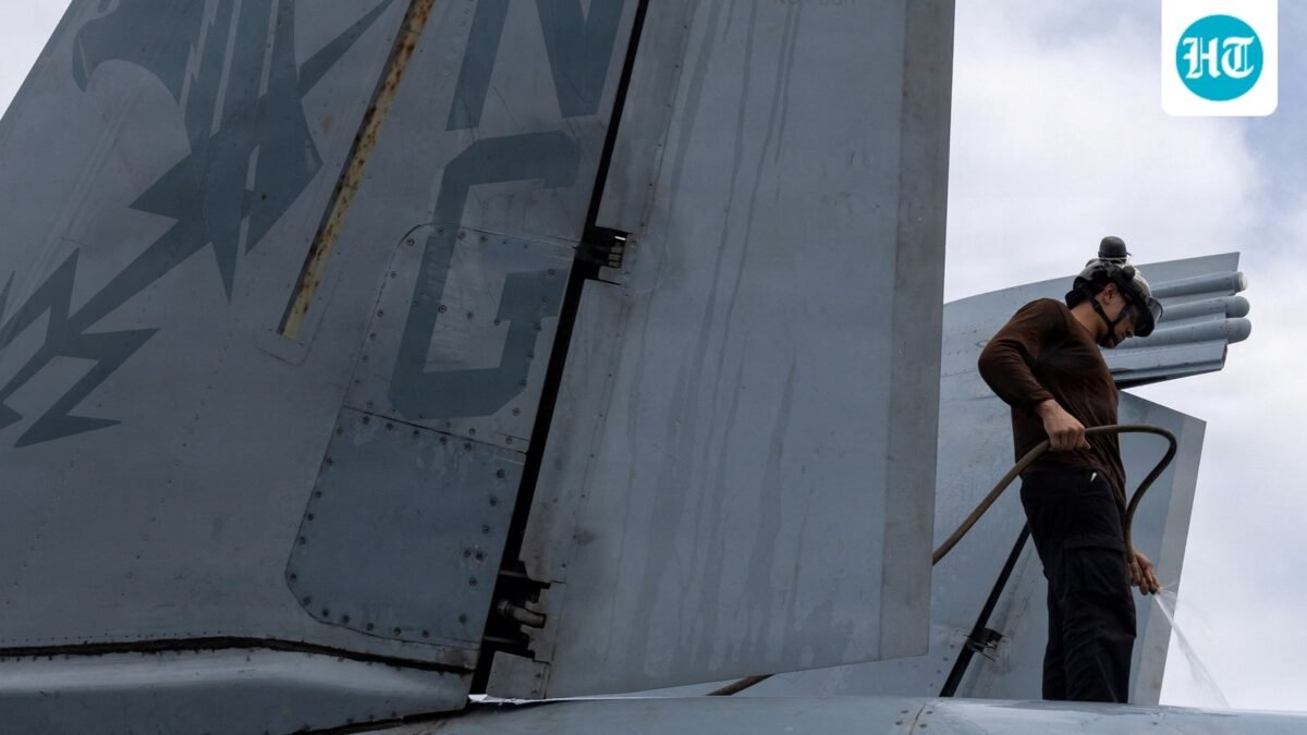 A U.S. sailor, assigned to Electronic Attack Squadron 133, washes an EA-18G Growler on the flight deck of the Nimitz-class aircraft carrier USS Abraham Lincoln during the ongoing conflict with Iran August 9, 2026.  U.S. Navy/Handout via REUTERS  THIS IMAGE HAS BEEN SUPPLIED BY A THIRD PARTY. (via REUTERS)