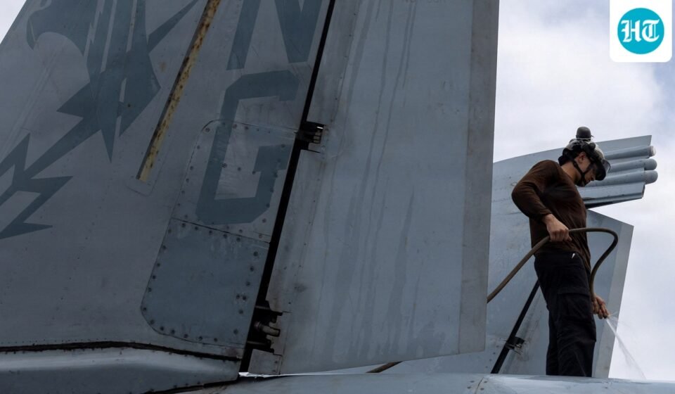 A U.S. sailor, assigned to Electronic Attack Squadron 133, washes an EA-18G Growler on the flight deck of the Nimitz-class aircraft carrier USS Abraham Lincoln during the ongoing conflict with Iran August 9, 2026.  U.S. Navy/Handout via REUTERS  THIS IMAGE HAS BEEN SUPPLIED BY A THIRD PARTY. (via REUTERS)