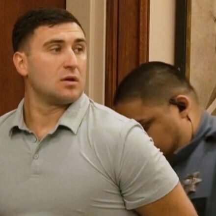 Jake Lang is led out of Judge H. Reid Poland III's courtroom in handcuffs during livestreamer Dalton Eatherly's hearing, Thursday, May 21, 2026, in Clarksville, Tenn. (AP Photo/Kristin Hall)