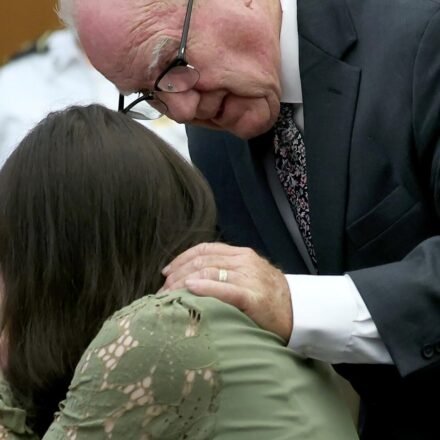 Defense attorney Kevin Reddington consoles his client, Lindsay Clancy, as she sobs during her murder trial at Plymouth Superior Court in Plymouth, Mass., Wednesday, Aug. 12, 2026. (Mark Stockwell/Boston Herald via AP, Pool) (Mark Stockwell/Pool The Boston H)