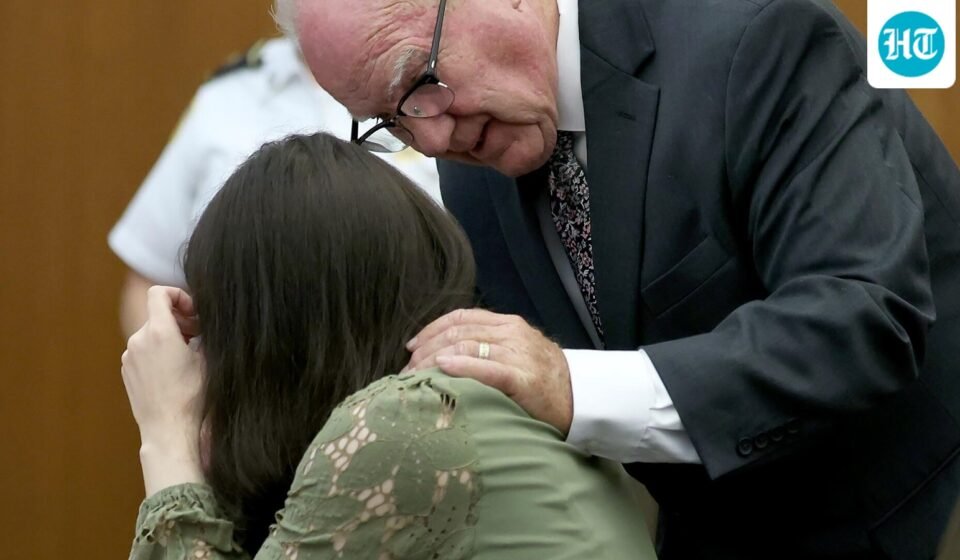 Defense attorney Kevin Reddington consoles his client, Lindsay Clancy, as she sobs during her murder trial at Plymouth Superior Court in Plymouth, Mass., Wednesday, Aug. 12, 2026. (Mark Stockwell/Boston Herald via AP, Pool) (Mark Stockwell/Pool The Boston H)