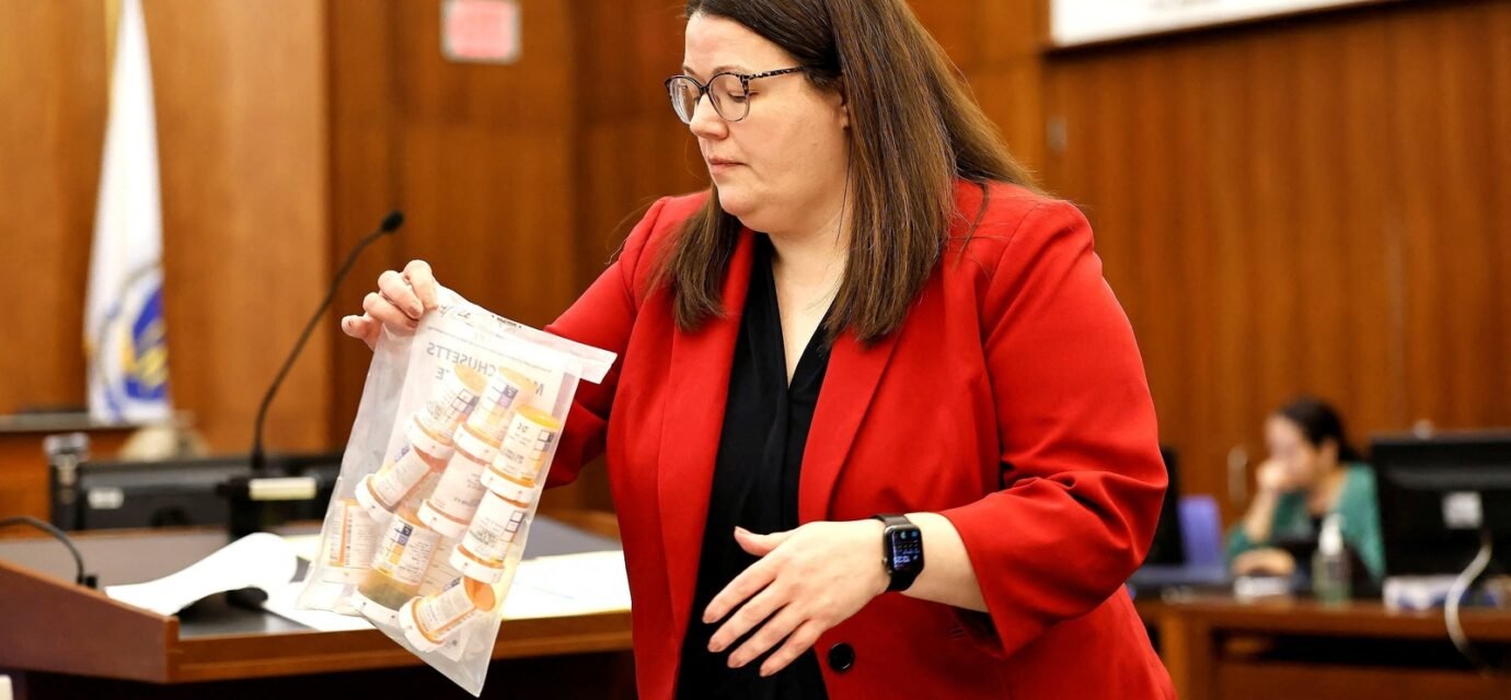 Prosecutor Jennifer Sprague of the Plymouth County DA's office enters a bag of prescription pills into evidence that were prescribed to Lindsay Clancy, who is accused of killing her children, during her murder trial at Plymouth Superior Court, in Plymouth, Massachusetts, U.S., July 27, 2026. Greg Derr/Pool via REUTERS (via REUTERS)