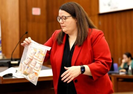 Prosecutor Jennifer Sprague of the Plymouth County DA's office enters a bag of prescription pills into evidence that were prescribed to Lindsay Clancy, who is accused of killing her children, during her murder trial at Plymouth Superior Court, in Plymouth, Massachusetts, U.S., July 27, 2026. Greg Derr/Pool via REUTERS (via REUTERS)