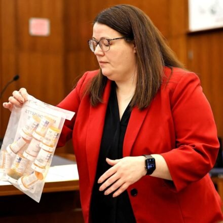 Prosecutor Jennifer Sprague of the Plymouth County DA's office enters a bag of prescription pills into evidence that were prescribed to Lindsay Clancy, who is accused of killing her children, during her murder trial at Plymouth Superior Court, in Plymouth, Massachusetts, U.S., July 27, 2026. Greg Derr/Pool via REUTERS (via REUTERS)