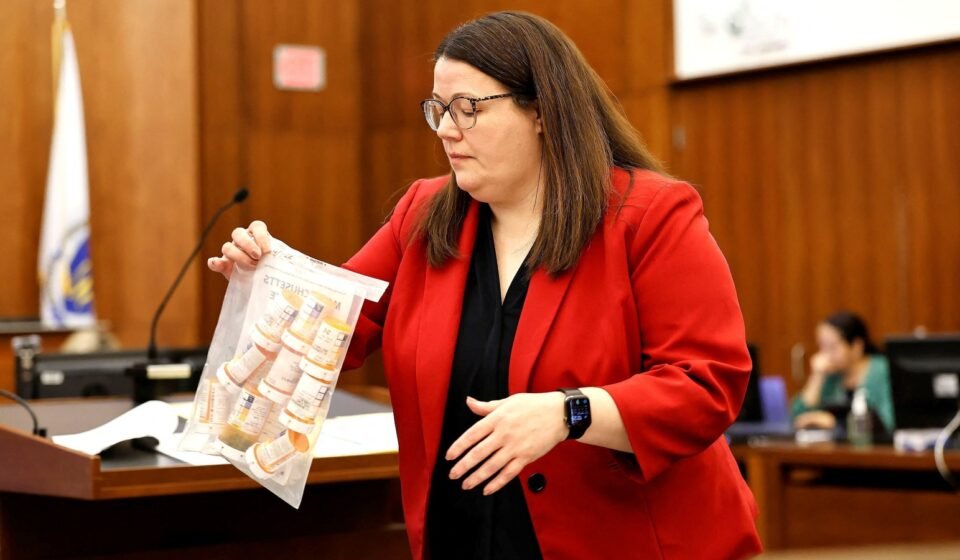 Prosecutor Jennifer Sprague of the Plymouth County DA's office enters a bag of prescription pills into evidence that were prescribed to Lindsay Clancy, who is accused of killing her children, during her murder trial at Plymouth Superior Court, in Plymouth, Massachusetts, U.S., July 27, 2026. Greg Derr/Pool via REUTERS (via REUTERS)
