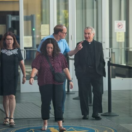 Michael and Paula Musgrove, the parents of Lindsay Clancy, who is accused of killing her children, leave the Plymouth Superior courthouse in Plymouth, Massachusetts, U.S., July 27, 2026.  Picture taken through a window. REUTERS/Brian Snyder (REUTERS)
