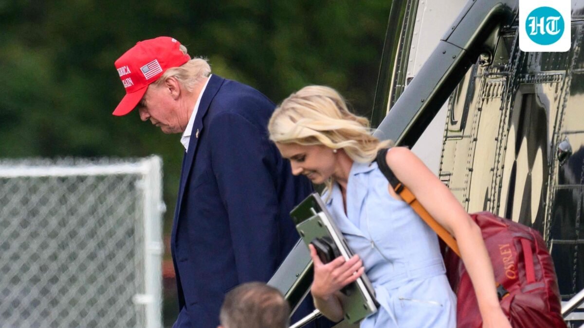 US President Donald Trump and aide Natalie Harp (R) exit Marine One on the Ellipse near the White House on August 16, 2026. (AFP)