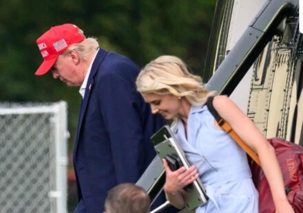 US President Donald Trump and aide Natalie Harp (R) exit Marine One on the Ellipse near the White House on August 16, 2026. (AFP)