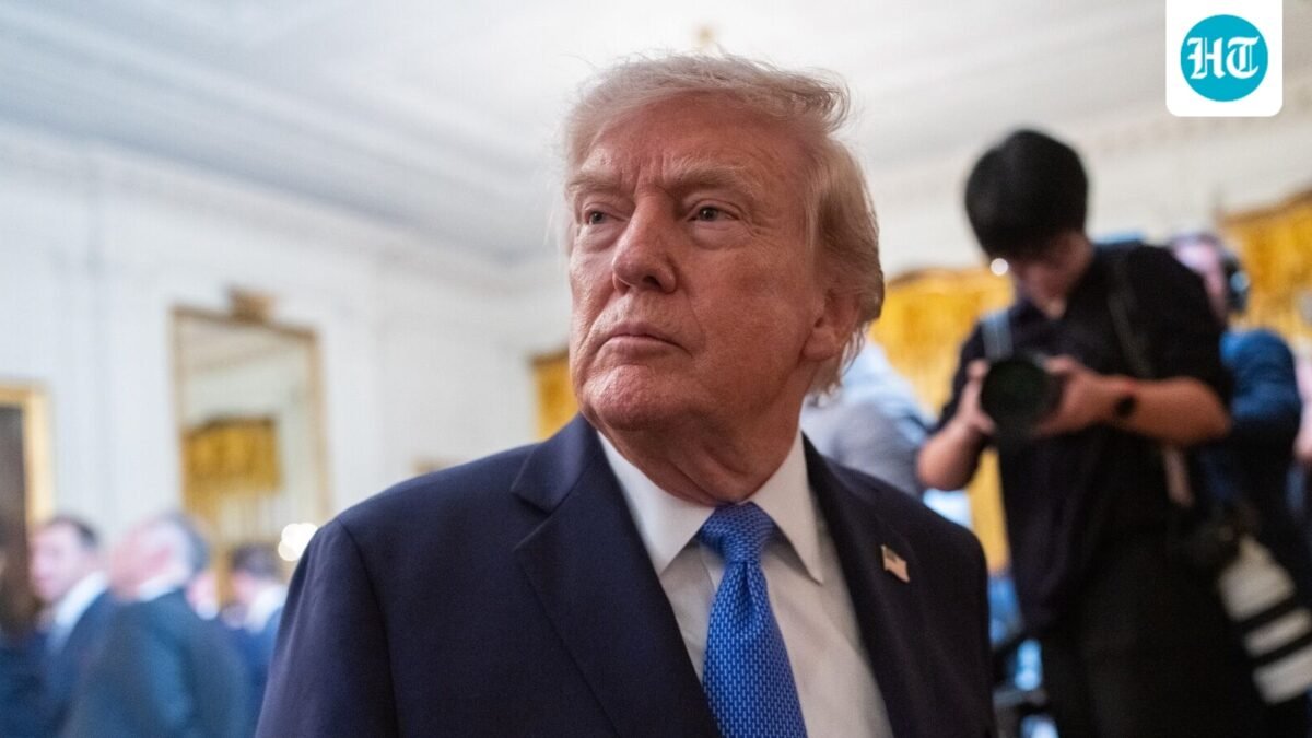 Trump signs an executive order in the Oval Office calling for the MMR vaccine to be split into three separate shots. (Bloomberg)