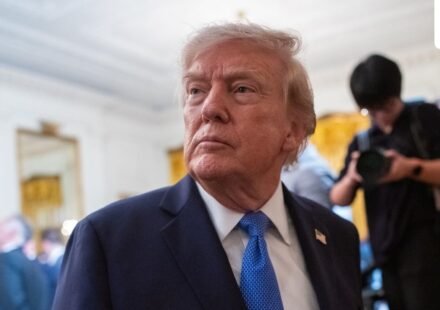 Trump signs an executive order in the Oval Office calling for the MMR vaccine to be split into three separate shots. (Bloomberg)