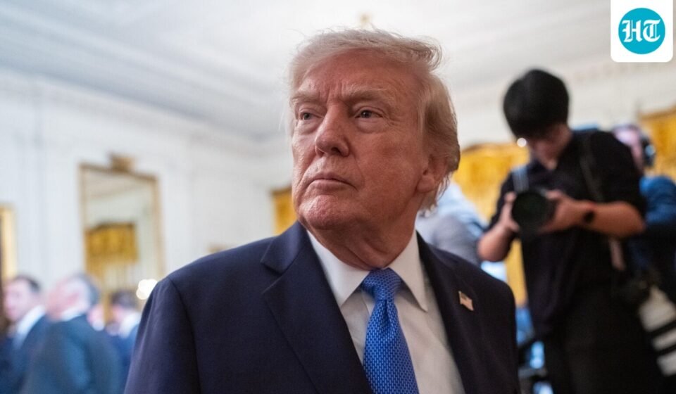 Trump signs an executive order in the Oval Office calling for the MMR vaccine to be split into three separate shots. (Bloomberg)