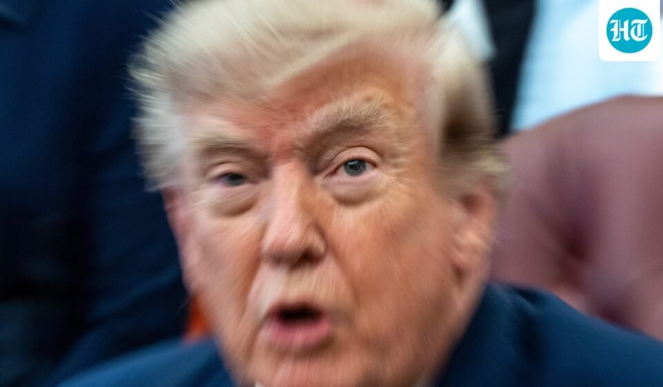 A zoom lens and slow shutter speed technique shows President Donald Trump speaking in the Oval Office of the White House, Monday, Aug. 3. (AP Photo/Alex Brandon)