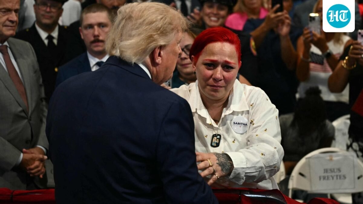 US President Donald Trump leaves stage to hug Jacob Freytes grieving parents. (AFP)
