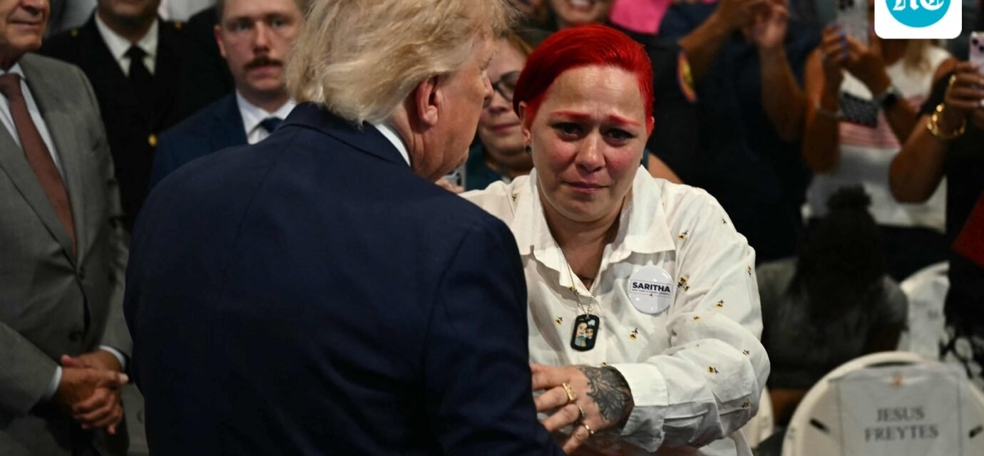 US President Donald Trump leaves stage to hug Jacob Freytes grieving parents. (AFP)