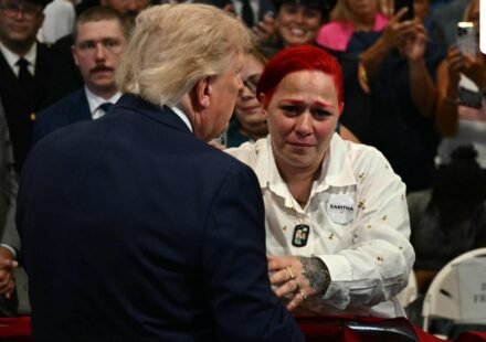 US President Donald Trump leaves stage to hug Jacob Freytes grieving parents. (AFP)