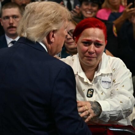 US President Donald Trump leaves stage to hug Jacob Freytes grieving parents. (AFP)