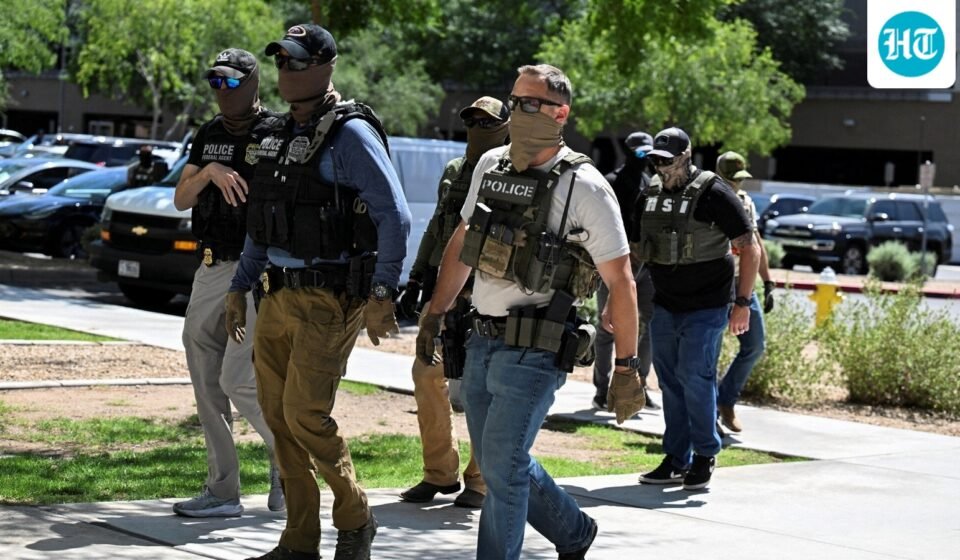 ICE agent pulls gun after Virginia woman confronts officers. (REUTERS)