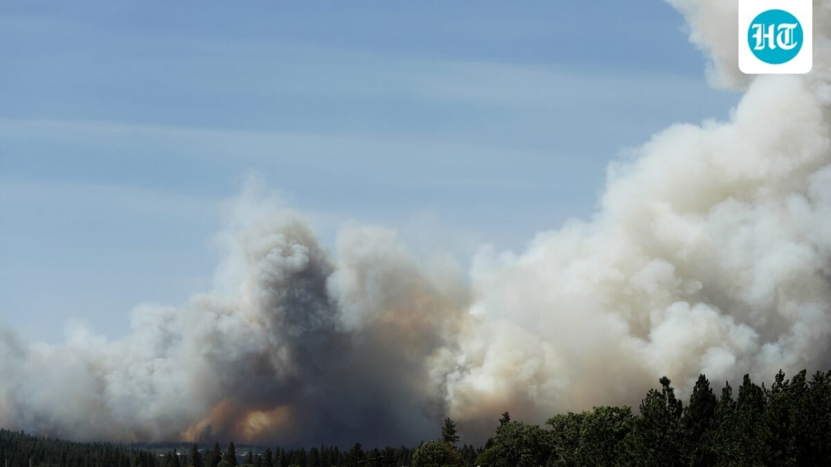 The Old Trails Fire is seen from the Centennial Trail near W. College Ave., in Spokane, Wash. (AP Photo/Young Kwak) (AP Photo/Young Kwak)