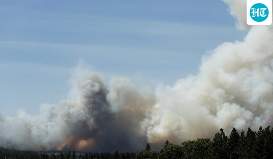 The Old Trails Fire is seen from the Centennial Trail near W. College Ave., in Spokane, Wash. (AP Photo/Young Kwak) (AP Photo/Young Kwak)