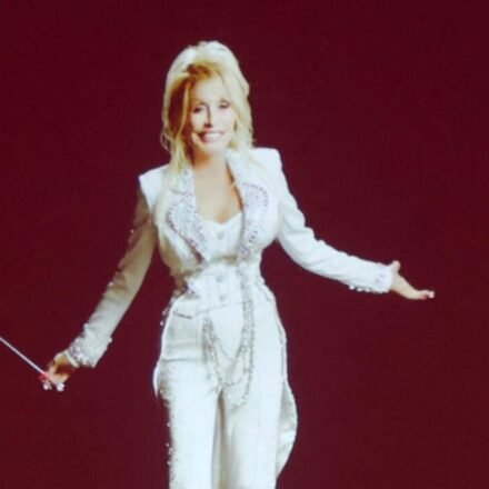 Dolly Parton is seen onscreen during "Dolly Parton's Threads: My Songs In Symphony" Premiere at Schermerhorn Symphony Center on June 16. (Getty Images via AFP)