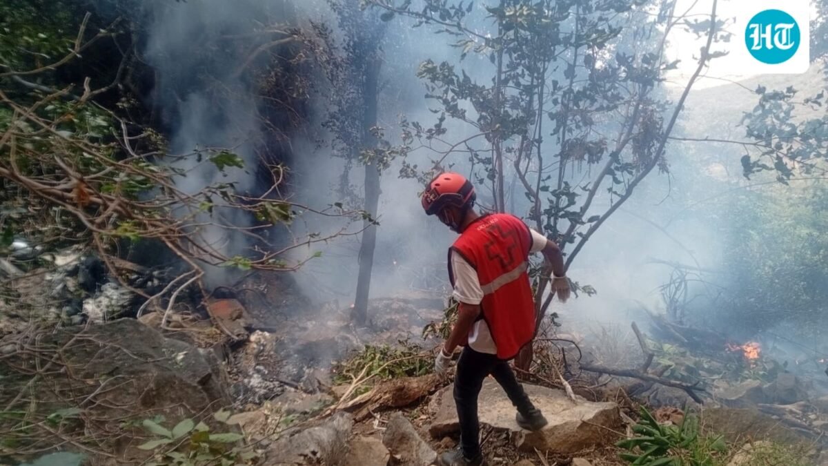 A rescue official works at the site of a tourist helicopter crash that caused multiple casualties, according to the police, in Samburu County, Kenya, August 19, 2026. (via REUTERS)