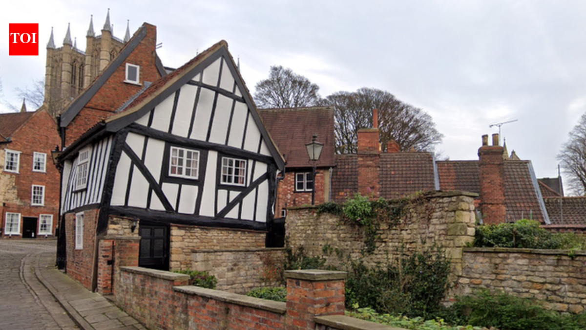In 1933, Lincoln's Crooked House was marked for demolition; work revealed a hidden timber-framed building behind its brick façade and saved it; today it is one of the Cathedral Quarter's most photographed buildings