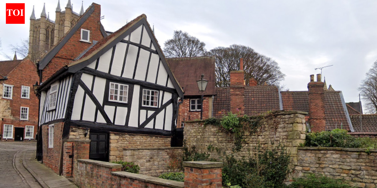 In 1933, Lincoln's Crooked House was marked for demolition; work revealed a hidden timber-framed building behind its brick façade and saved it; today it is one of the Cathedral Quarter's most photographed buildings