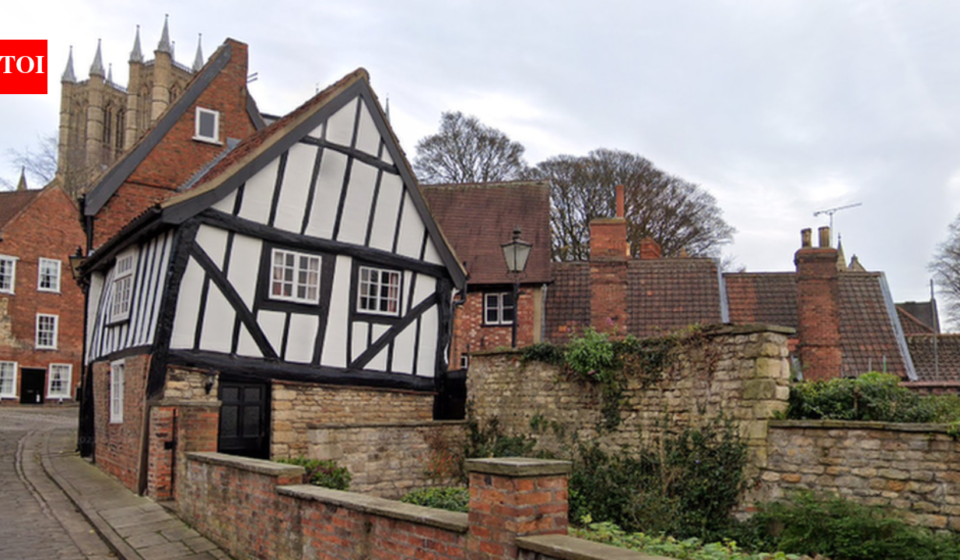In 1933, Lincoln's Crooked House was marked for demolition; work revealed a hidden timber-framed building behind its brick façade and saved it; today it is one of the Cathedral Quarter's most photographed buildings
