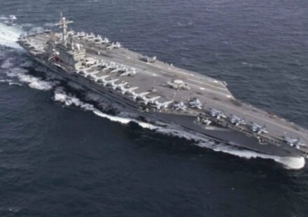 USS Abraham Lincoln sails past Singapore on way home after gruelling Middle East deployment